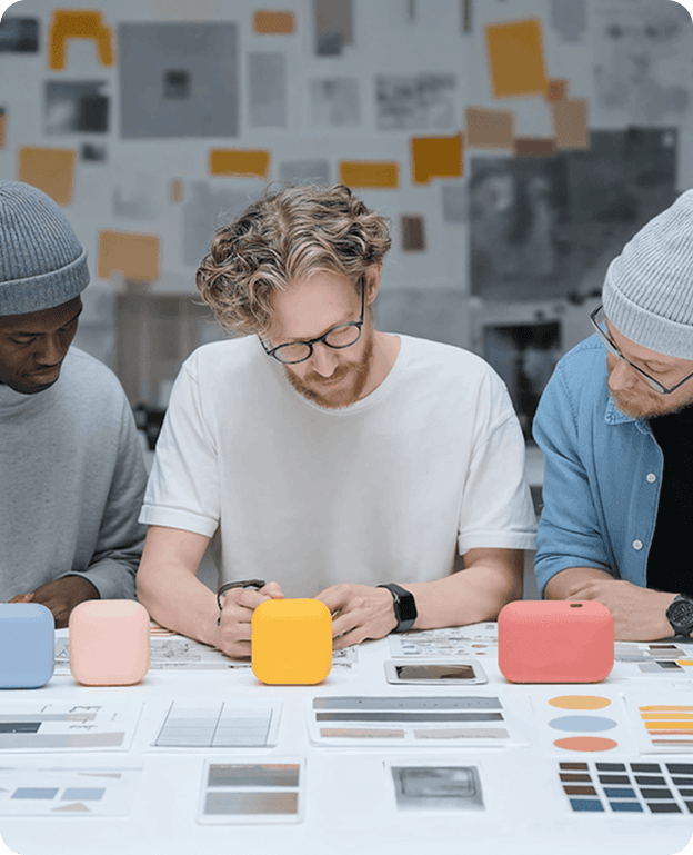 A product design team collaborating around a table